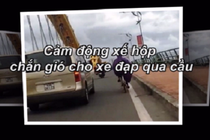 Video: Soái ca ô tô lái kèm che gió cho xe đạp lên cầu