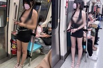 Đỏ mặt hot girl “mặc như không” lộ vòng 1 hớ hênh trên tàu