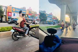 Kinh hãi bố để con gái đứng sau yên xe phóng vun vút