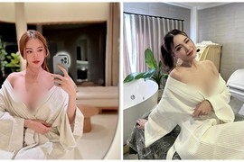 Hot girl cố tình kéo áo choàng tắm, để lộ gần hết vòng một