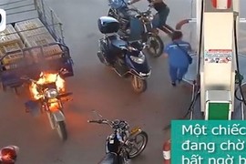 Video: Cháy ở cây xăng, 4 người đàn ông tháo chạy, nữ nhân viên lao vào dập lửa 