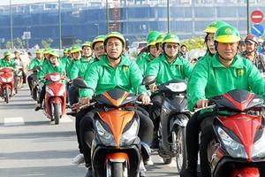 Thương vụ Grab "thâu tóm" Uber: "Ông lớn" taxi Việt đáp trả như thế nào?