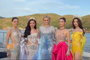 Thùy Tiên khổ sở kiễng chân khi đứng cạnh Miss World 2021 