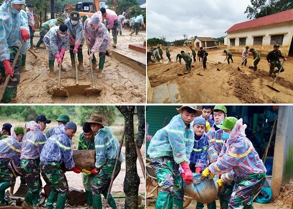 Công an lội bùn giúp dân dọn dẹp sau lũ