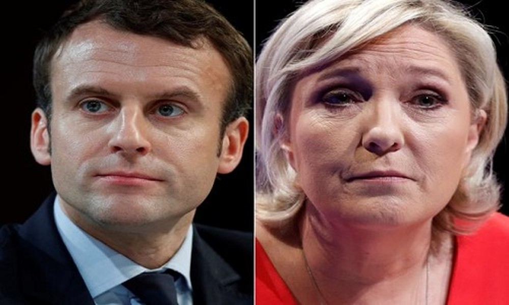 Trong cuộc bỏ phiếu vòng 1 bầu cử Tổng thống Pháp ngày 23/4, bà Marine Le Pen, ứng viên của Đảng cực hữu Mặt trận Dân tộc (FN), và ông Emmanuel Macron, thủ lĩnh phong trào “Tiến bước”, đã giành chiến thắng và sẽ bước tiếp vào vòng 2. Ảnh: Reuters.