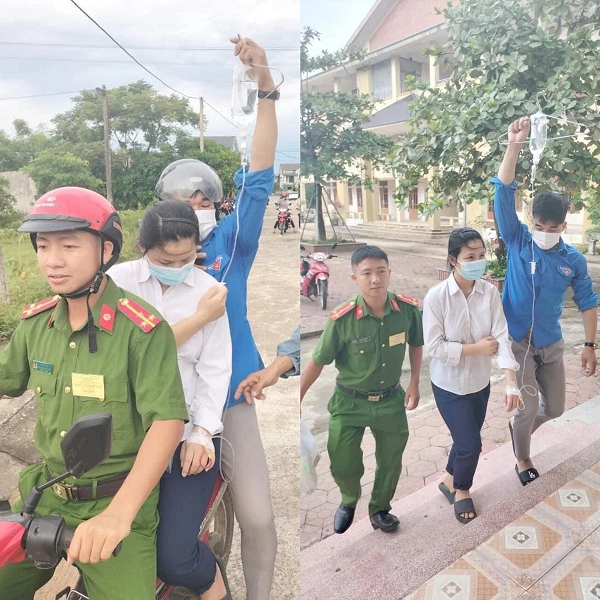 Em học trò đầy nghị lực mang theo bình truyền nước được công an và đội thanh niên tự nguyện đưa tới điểm thi ở Kỳ Anh, Hà Tĩnh. 