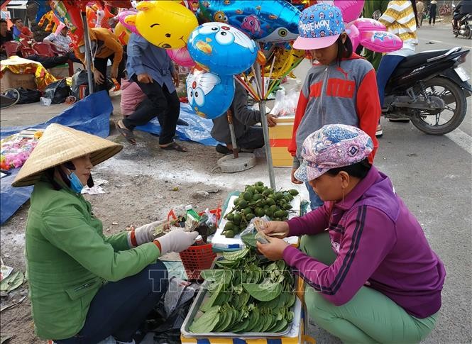 Hội chợ Gò – Trường Úc (thị trấn Tuy Phước, Bình Định) nổi tiếng là  phiên chợ chỉ họp một lần duy nhất vào sáng mùng 1 Tết hàng năm. Ảnh: TTXVN.