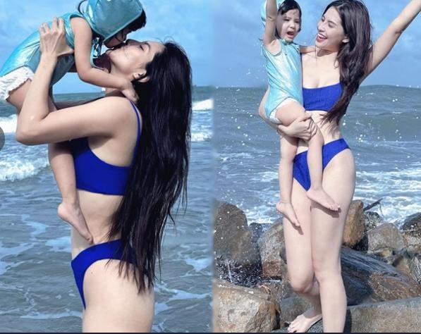  Thiên An gây chú ý khi đăng tải loạt ảnh diện bikini khoe dáng bên con gái nhận "cơn mưa lời khen". Cô nàng nổi bật với vóc dáng đầy đặn cùng làn da trắng mịn. "Đúng là gái một con trong mòn con mắt là có thật", một bình luận của dân mạng.