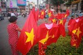 Rực trời cờ đỏ sao vàng khắp phố Sài Gòn trước trận chung kết U22 Việt Nam - U22 Indonesia