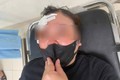 Người phụ nữ bị tài xế dùng dùi cui vụt vào đầu