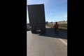 Video: Hoảng hồn xe máy núp hông container để tránh nắng