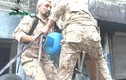 Phe nổi dậy Syria bắn bình gas vào quân chính phủ