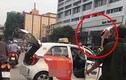 Bị CSGT "tuýt còi", tài xế taxi leo lên nóc xe ăn vạ