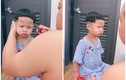 Bố cắt tóc cho con, biểu cảm của cậu bé khiến netien phì cười