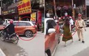 Video: Bị CSGT nhắc nhở, nữ tài xế đỗ ô tô giữa đường chống đối