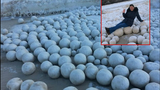 Ngỡ ngàng hàng nghìn quả bóng bằng tuyết trôi dạt vào bờ biển
