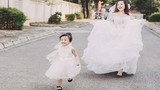 Bà mẹ đơn thân và con gái xinh đẹp trong váy cưới
