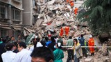 Nhà 9 tầng ở Trung Quốc bất ngờ đổ sập