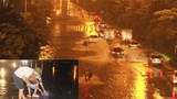 Mưa lớn, đường biến thành sông người dân bắt cá trên đường Hà Nội