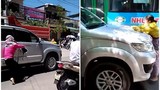 Video: Vợ đánh đu trên nóc capo, chặn xe chồng chở bồ nhí