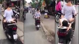 Video: Hoảng hồn cảnh mẹ chở con nằm dài sau xe máy