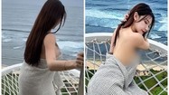 “Quên nội y”, hot girl giữ chặt tấm chăn khi tạo dáng trên biển