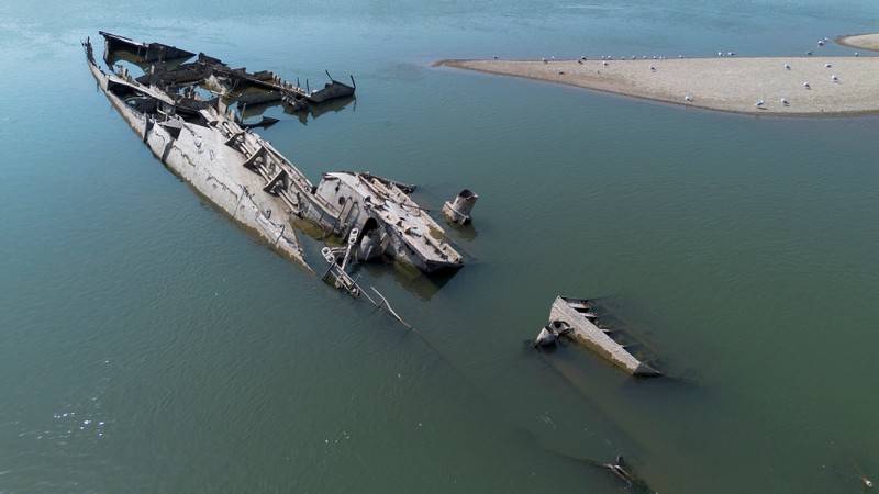 A drone image shows a sunken German warship from World War II, exposed due to low Danube river levels caused by drought and extreme heat, in Prahovo