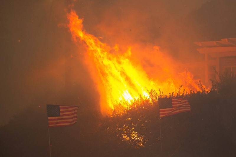 Palisades fire burns during a weather driven windstorm on the west side of Los Angeles