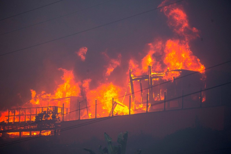 Palisades fire burns during a weather-driven windstorm on the west side of Los Angeles