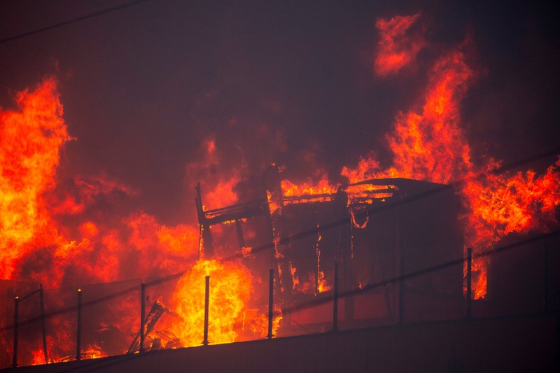 Palisades fire burns during a weather driven windstorm on the west side of Los Angeles