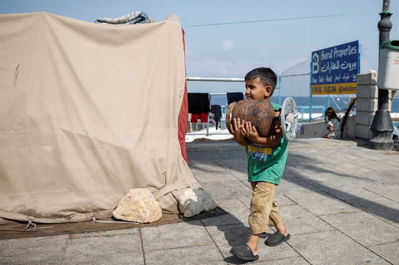 Displaced families shelter amid ongoing conflict, in Beirut