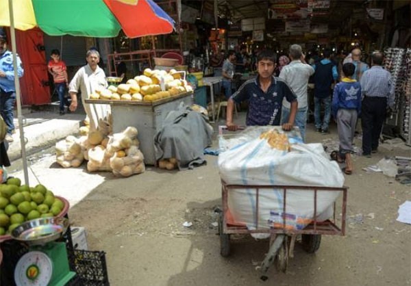 Anh: Nguoi dan Iraq tung bung mua sam o Dong Mosul-Hinh-8