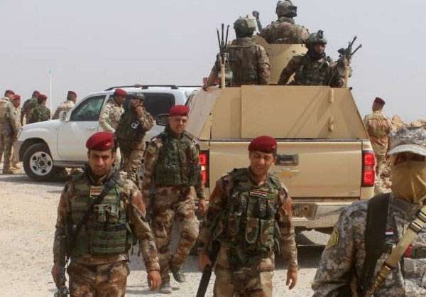 Anh: Iraq giai phong vung trong yeu gan bien gioi voi Syria-Hinh-9