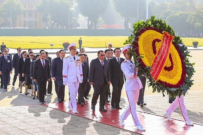 Toàn cảnh chuyến thăm Việt Nam của Tổng Bí thư, Chủ tịch nước Lào - Ảnh 10