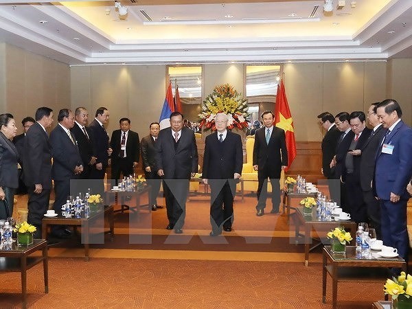 Toàn cảnh chuyến thăm Việt Nam của Tổng Bí thư, Chủ tịch nước Lào - Ảnh 20