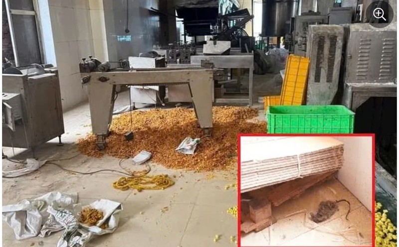 Ha Noi: SX banh keo, chien bim bim bang dau “den nhu nuoc cong”