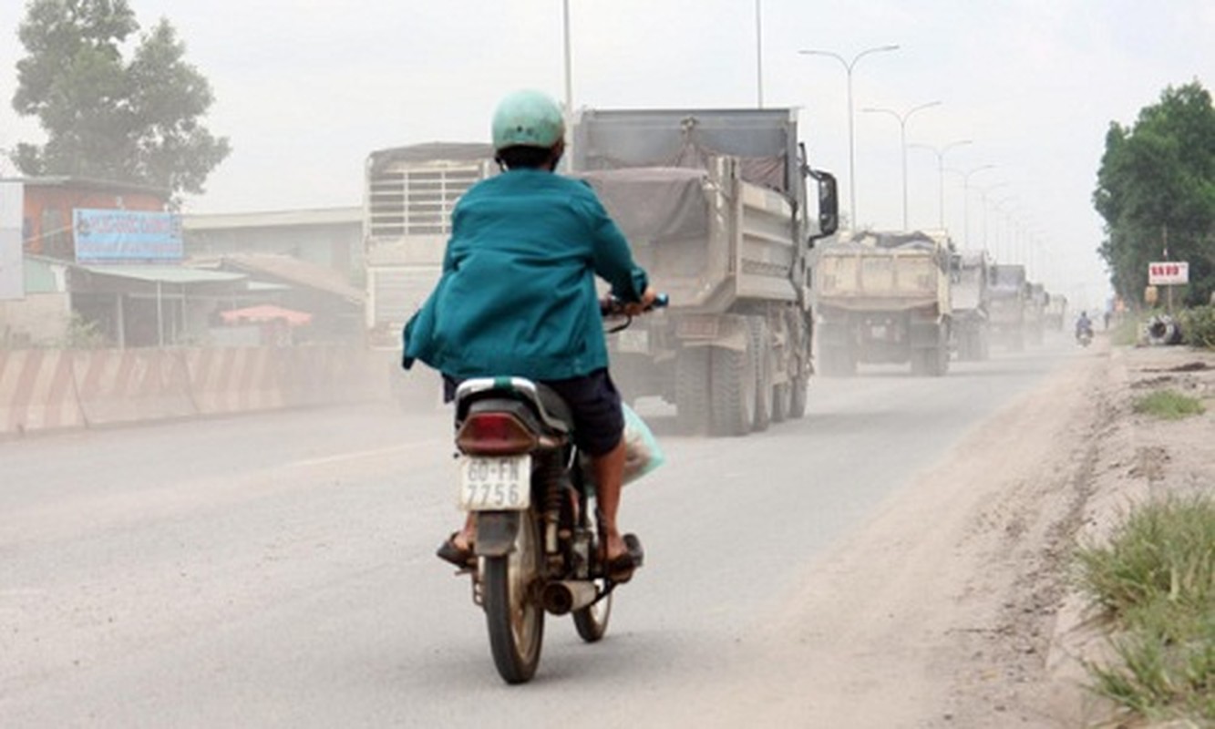 Anh: BOT duong tranh Bien Hoa “ngap chim” trong khoi bui